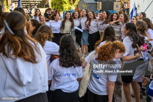 Group of girls on a program dance and sing in solidarity after an event for the release of hostages outside The Museum of Art known as the 'The...
