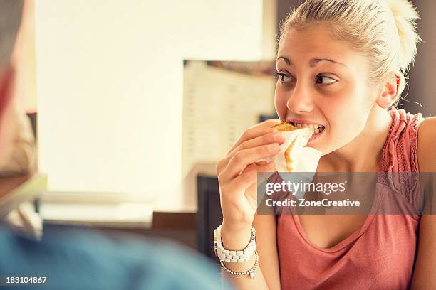 young woman eat a toast at italian café - paranoia 2013 film stock-fotos und bilder