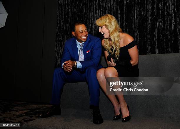 Tiger Woods of the U.S. Team and Lindsey Voon at the opening ceremonies at Columbus Commons prior to the start of The Presidents Cup on October 2,...