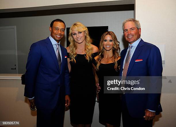 Tiger Woods, Lindsey Vonn, Nadine Moze and Fred Couples of the U.S. Team at the opening ceremonies at Columbus Commons prior to the start of The...