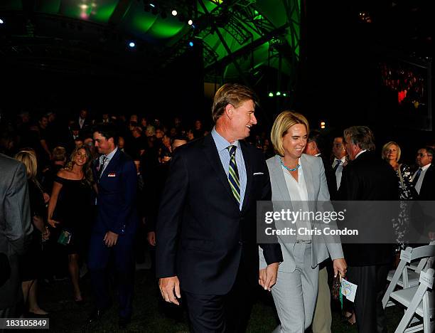 Ernie Els of the International Team and his wife Liezl Els at the opening ceremonies at Columbus Commons prior to the start of The Presidents Cup on...