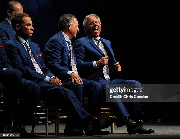 Team captain Fred Couples share a laugh with Jay Haas at the opening ceremonies at Columbus Commons prior to the start of The Presidents Cup on...