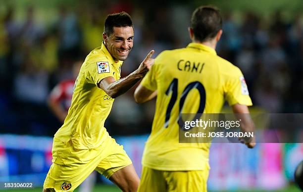 Villarreal's midfielder Bruno Soriano celebrates his goal with Villarreal's midfielder Cani during the Spanish league football match Villarreal CF vs...