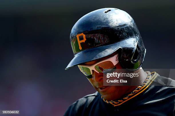 Marlon Byrd of the Pittsburgh Pirates walks back to the dugout after striking out in the second inning against the St. Louis Cardinals during Game...