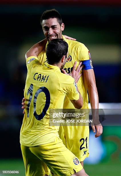 Villarreal's midfielder Bruno Soriano celebrates his goal with Villarreal's midfielder Cani during the Spanish league football match Villarreal CF vs...