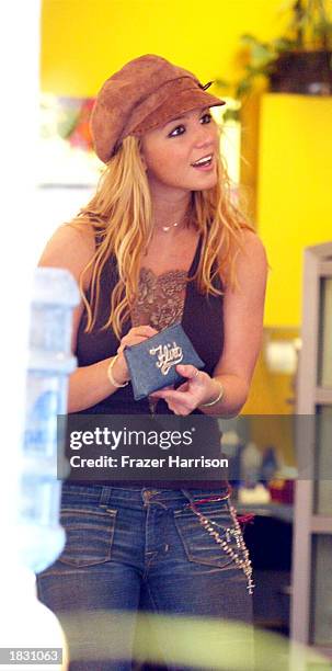 Singer Britney Spears shops for eyeglasses on Melrose Avenue on March 5, 2003 in Los Angeles, California.