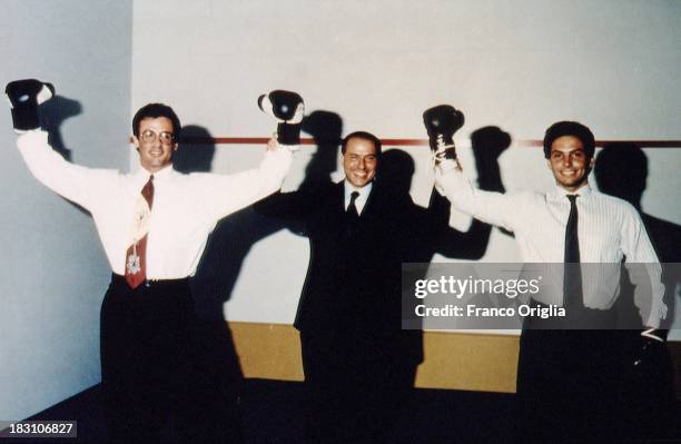 Actor Sylvester Stallone, Silvio Berlusconi and his son Pier Silvio Berlusconi wearing boxing gloves in 1993 in Milan, Italy.