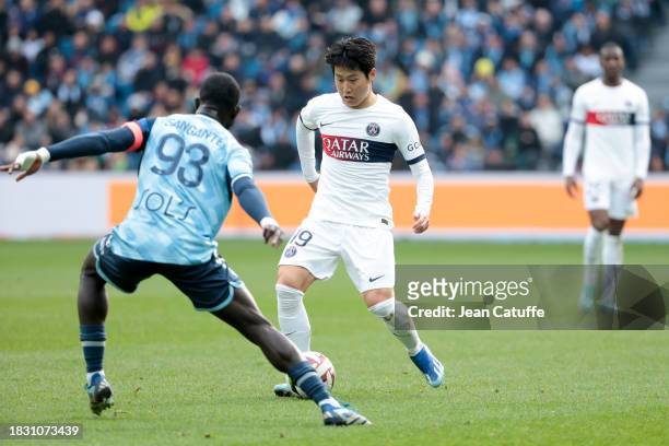 Lee Kang-in of PSG in action during the Ligue 1 Uber Eats match between Le Havre AC and Paris Saint-Germain at Stade Oceane on December 3, 2023 in Le...