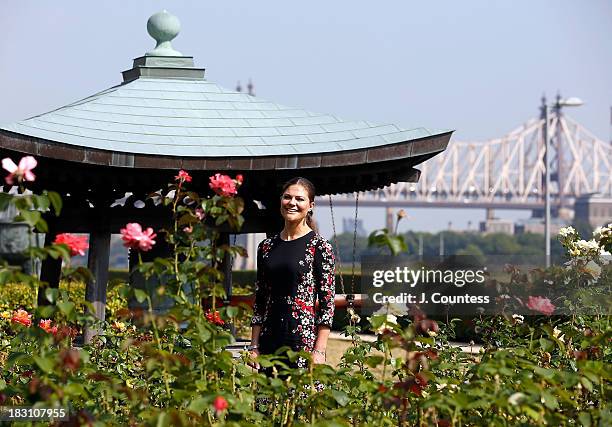 Crown Princess Victoria Of Sweden poses for a photo ih the United Nations Rose garden during a visit the United Nations on October 4, 2013 in New...