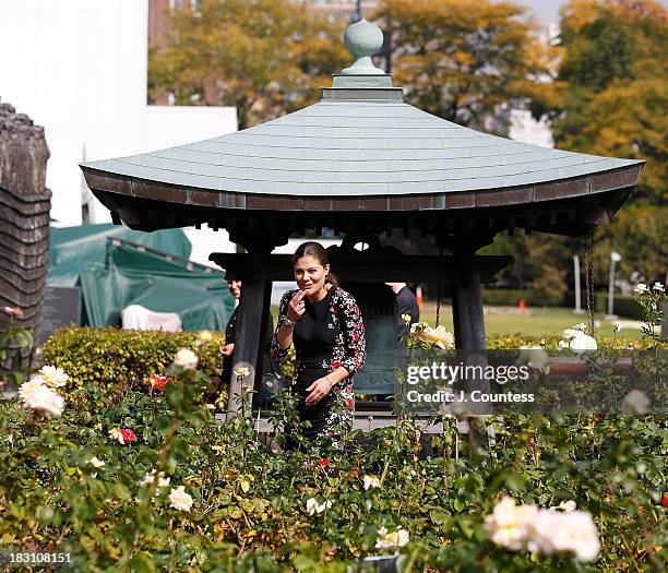 Crown Princess Victoria Of Sweden jokes with photographers as she walks through the United Nations Rose garden during a visit the United Nations on...