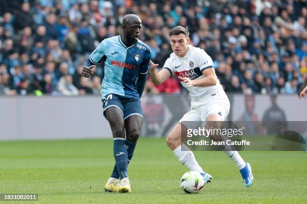 Abdoulaye Toure of Le Havre, Manuel Ugarte of PSG in action during the Ligue 1 Uber Eats match between Le Havre AC and Paris Saint-Germain at Stade...