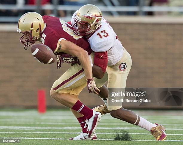 Boston College Eagles Alex Amidon cannot hold on as he is pressured from Florida State Seminoles Jalen Ramsey during second half action at Alumni...