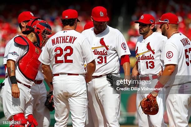 Lance Lynn of the St. Louis Cardinals is taken out in the fifth inning by manager Mike Matheny of the St. Louis Cardinals while taking on the...