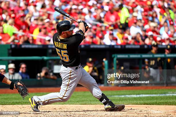 Russell Martin of the Pittsburgh Pirates hits a RBI single in the fifth inning against the St. Louis Cardinals during Game Two of the National League...