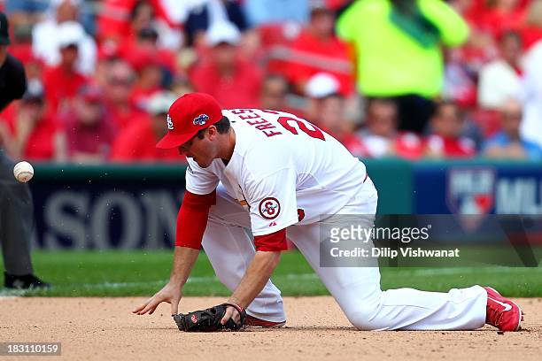David Freese of the St. Louis Cardinals is unable to field a groundball and is called for an error on a ball hit by Marlon Byrd of the Pittsburgh...