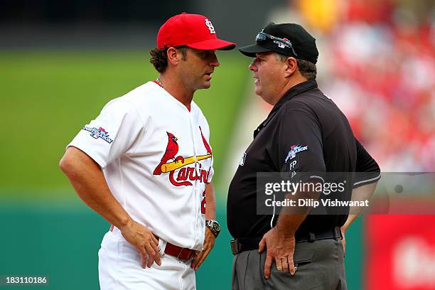 Manager Mike Matheny of the St. Louis Cardinals argues with first base umpire Jerry Layne in the seventh inning against the Pittsburgh Pirates during...