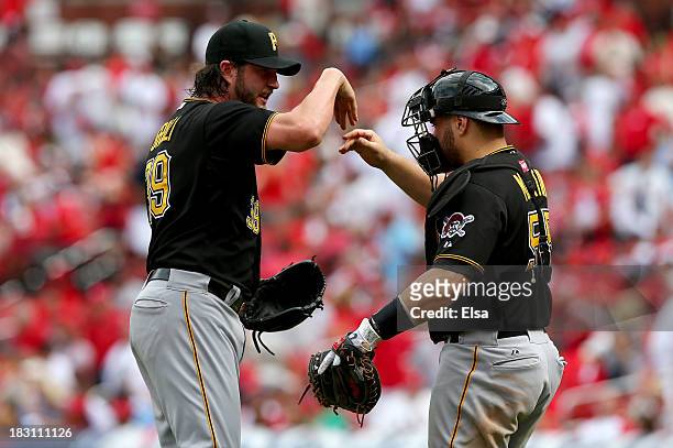 Jason Grilli of the Pittsburgh Pirates and catcher Russell Martin celebrate the Pirates 7-1 victory against the St. Louis Cardinals during Game Two...