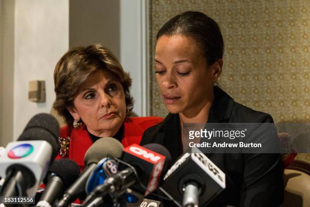 Attorney Gloria Allred , who is representing the family of Edwin Mieses Jr., listens as Dayana Mejia , wife of Mieses, speaks at a press conference...