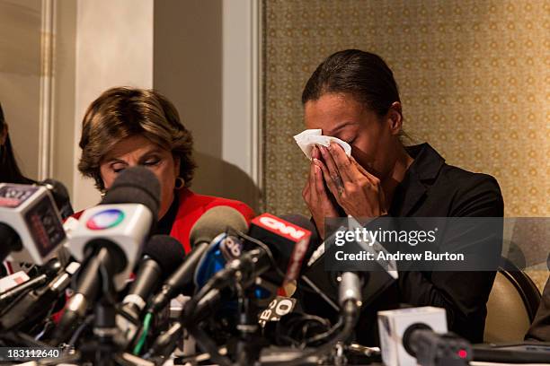 Attorney Gloria Allred , who is representing the family of Edwin Mieses Jr,, comforts Dayana Mejia , wife of Mieses, at a press conference October 4,...