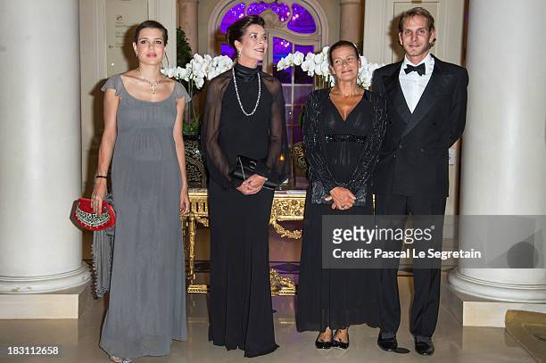 Charlotte Casiraghi, Princess Caroline of Hanover, Princess Stephanie of Monaco and Andrea Casiraghi pose as they arrive to attend the AMADE MONDIALE...
