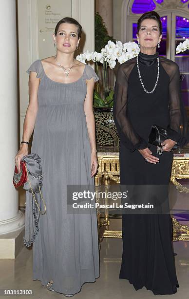 Charlotte Casiraghi and her mother Princess Caroline of Hanover pose as they arrive to attend the AMADE MONDIALE association Gala Dinner at Hotel...