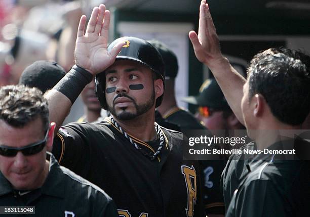 The Pittsburgh Pirates' Pedro Alvarez is congratulated by his teammates after his home run against the St. Louis Cardinals in Game 2 of the National...