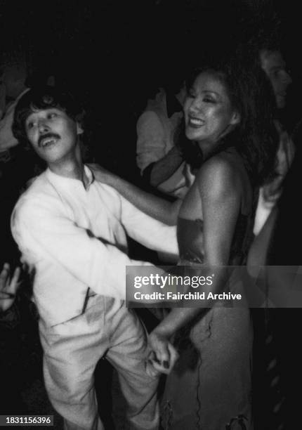 Outtake; Also ran in WWD 4/28/1978 p.64; Guests on the dance floor during a party to celebrate the one year anniversary of Studio 54, with special...