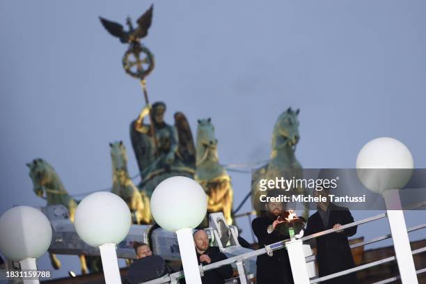 German Chancellor Olaf Scholz and Rabbi Yehuda Teichtal inaugurate a giant, illuminated menorah to celebrate the beginning of Hanukkah on December 7,...