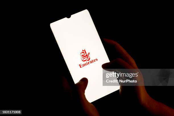 The Emirates Airlines logo is being displayed on a smartphone screen in Athens, Greece, on December 7, 2023.