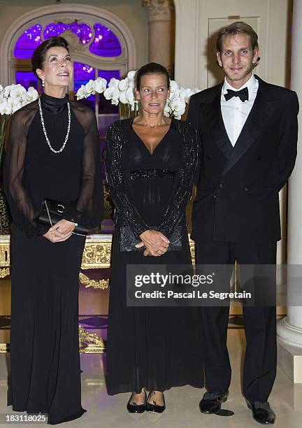 Princess Caroline of Hanover, Princess Stephanie of Monaco and Andrea Casiraghi pose as they arrive to attend the AMADE MONDIALE association Gala...