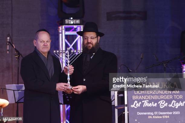 German Chancellor Olaf Scholz and Rabbi Yehuda Teichtal inaugurate a giant, illuminated menorah to celebrate the beginning of Hanukkah on December 7,...