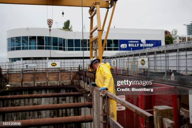 Technicore Underground employee monitors construction on the Billy Bishop Toronto City Airport pedestrian tunnel in Toronto, Ontario, Canada, on...
