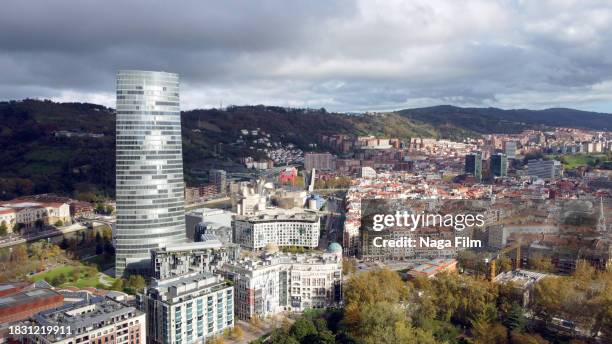 drone shot over bilbao, spain during the day time. - drone images stock-fotos und bilder