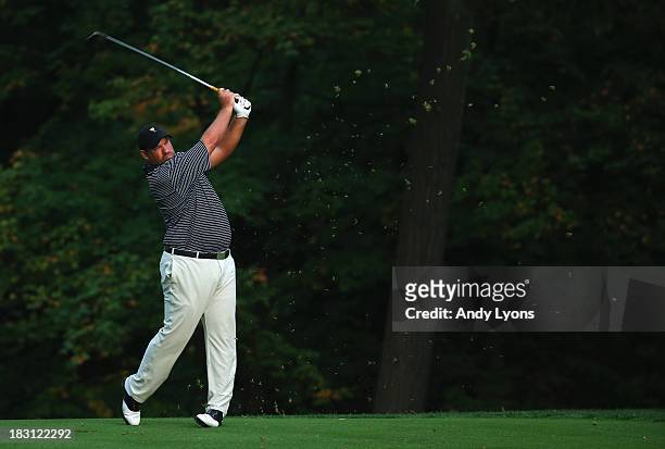Brendon de Jonge of Zimbabwe hits his second shot on the 15th hole during the Day Two Foursome Matches at the Muirfield Village Golf Club on October...