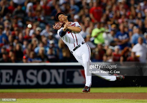 Andrelton Simmons of the Atlanta Braves throws to first in the seventh inning against the Los Angeles Dodgers during Game Two of the National League...