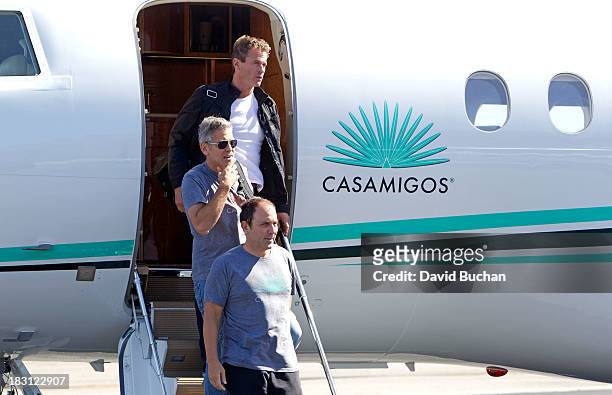 George Clooney, Rande Gerber and Mike Meldman Landing on their Casamigos Tequila Plane after attending the NY "Gravity" Premiere at the Van Nuys...