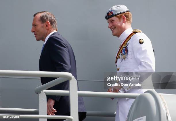Prime Minister Tony Abbott and HRH Prince Harry are seen on board the Leeuwin on October 5, 2013 in Sydney, Australia. Over 50 ships participate in...