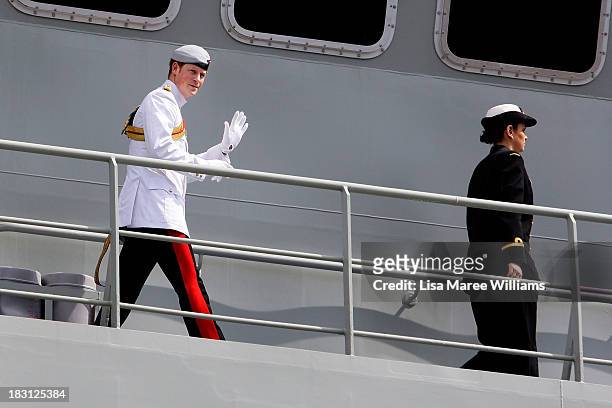 Prince Harry waves to the crowd from aboard the Leeuwin on October 5, 2013 in Sydney, Australia. Over 50 ships participate in the International Fleet...