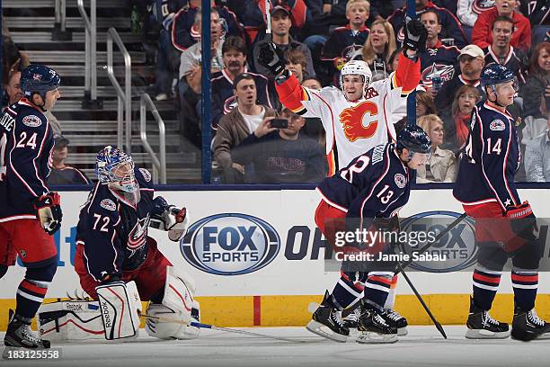 Curtis Glencross of the Calgary Flames celebrates after scoring a goal late in the third period on October 4, 2013 at Nationwide Arena in Columbus,...