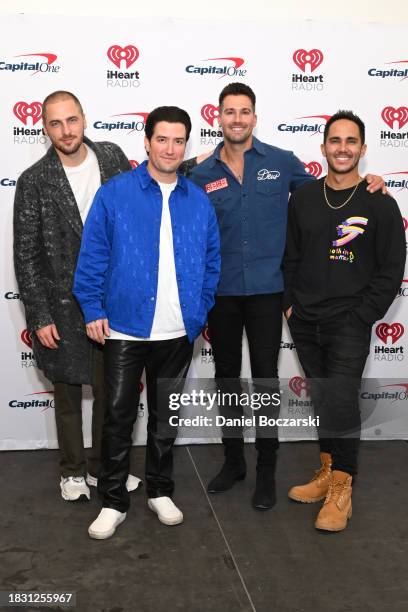 Kendall Schmidt, Logan Henderson, James Maslow, and Carlos PenaVega of Big Time Rush attend iHeartRadio 103.5 KISS FM's Jingle Ball 2023 at Allstate...