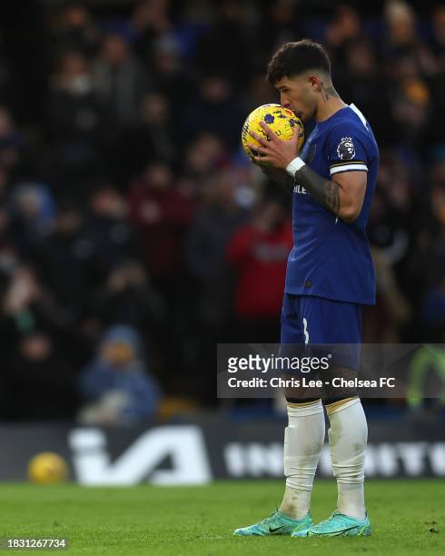 Enzo Fernandez of Chelsea kisses the ball before he takes a penalty during the Premier League match between Chelsea FC and Brighton & Hove Albion at...