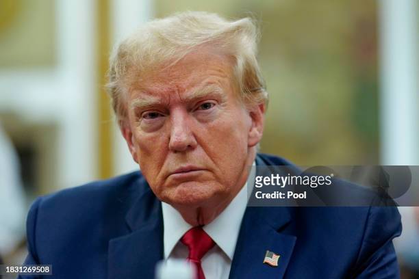 Former U.S. President Donald Trump sits at the defense table while waiting for proceedings to begin in his civil business fraud trial in New York...