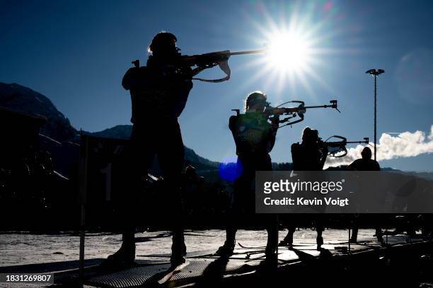 Elisa Gasparin of Switzerland and Juni Arnekleiv of Norway at the shooting range as a silhouette during the Training Women and Men at the BMW IBU...