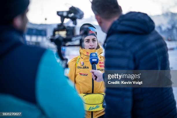 Vanessa Voigt of Germany looks on during a television interview after the Training Women and Men at the BMW IBU World Cup Biathlon Hochfilzen on...