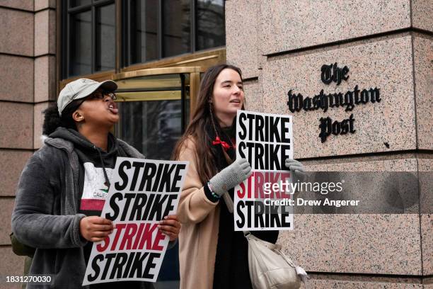 Employees of the Washington Post walk a picket line as they stage as 24 hour strike outside the Washington Post building December 7, 2023 in...