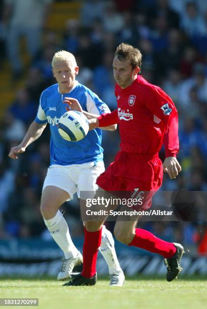 September 24: Dietmar Hamann of Liverpool and Mikael Forssell of Birmingham City challenge during the Premier League match between Birmingham City...