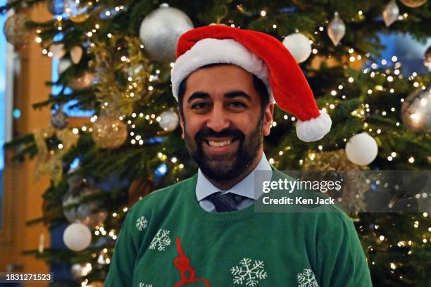 First Minister Humza Yousaf poses in a Christmas jumper in the lobby of the Scottish Parliament following First Minister's Questions, in support of...