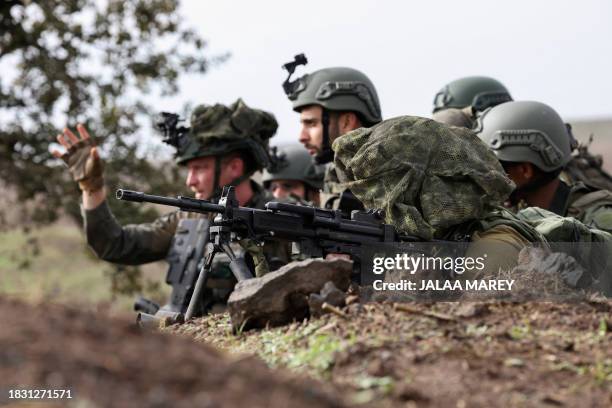 Members of the Israeli army's infantry 6th brigade take part in an assault coordination exercise near Moshav Kidmat Tsvi in the Israel-annexed Golan...