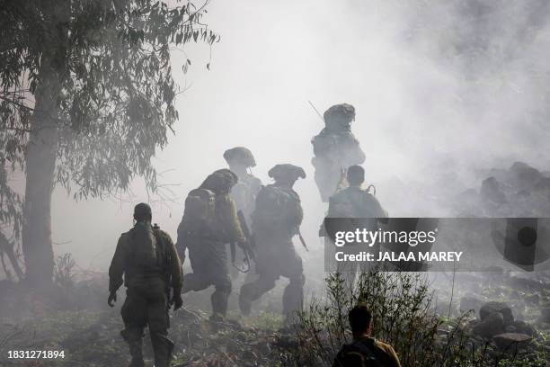 Members of the Israeli army's infantry 6th brigade take part in an assault coordination exercise near Moshav Kidmat Tsvi in the Israel-annexed Golan...