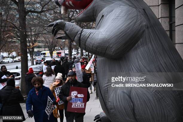 Employees of the Washington Post, joined by supporters, walk the picket line during a 24 hour strike, outside of Washington Post headquarters in...